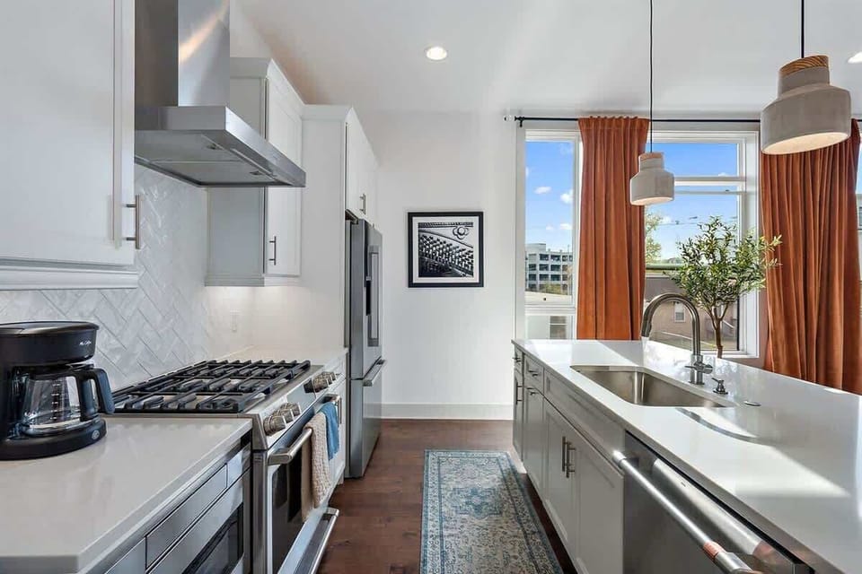 Bright kitchen area filled with natural light, creating a warm and inviting space for cooking and gathering.