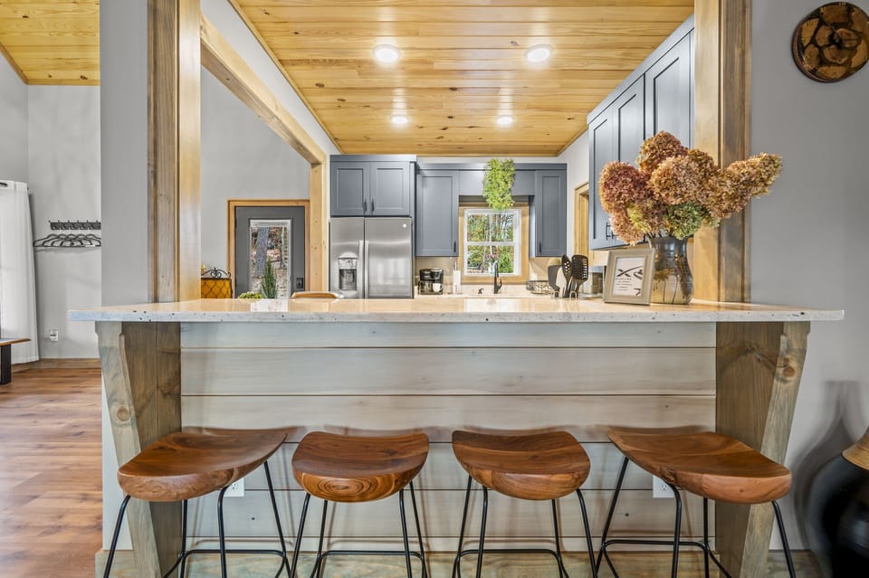 Cozy up to the kitchen breakfast counter for conversation or to share a snack