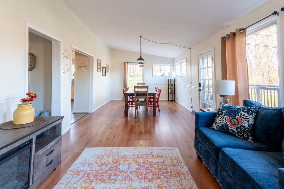 The spacious sunroom/dining room can serve as a second living room