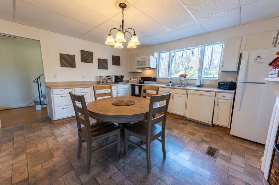 The kitchen has all the essentials: fridge, dishwasher, oven/range, microwave.