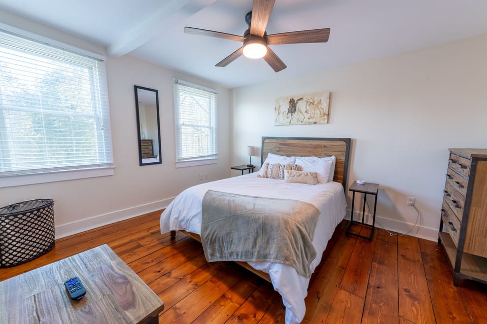 Bedroom 1 has a Roku-enabled TV and a queen bed.