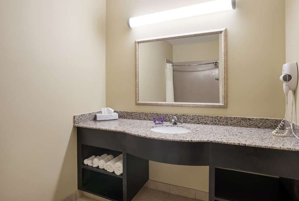 Refresh easily with a wide vanity and bright mirror lighting.
