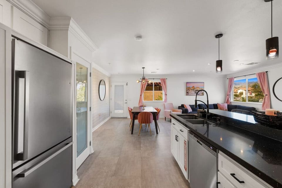 Central dining area connecting the kitchen and living room for effortless group hangouts.