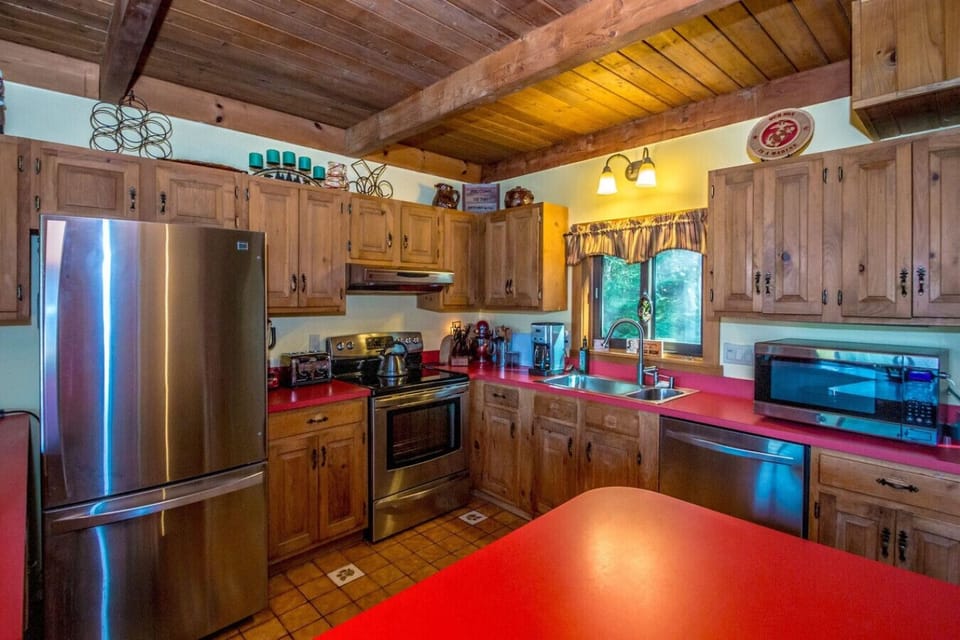 Fully equipped kitchen with everything you need for a great family meal, plus coffee and tea to start your day. Enjoy cooking indoors or fire up the grill on the back deck while taking in the views.