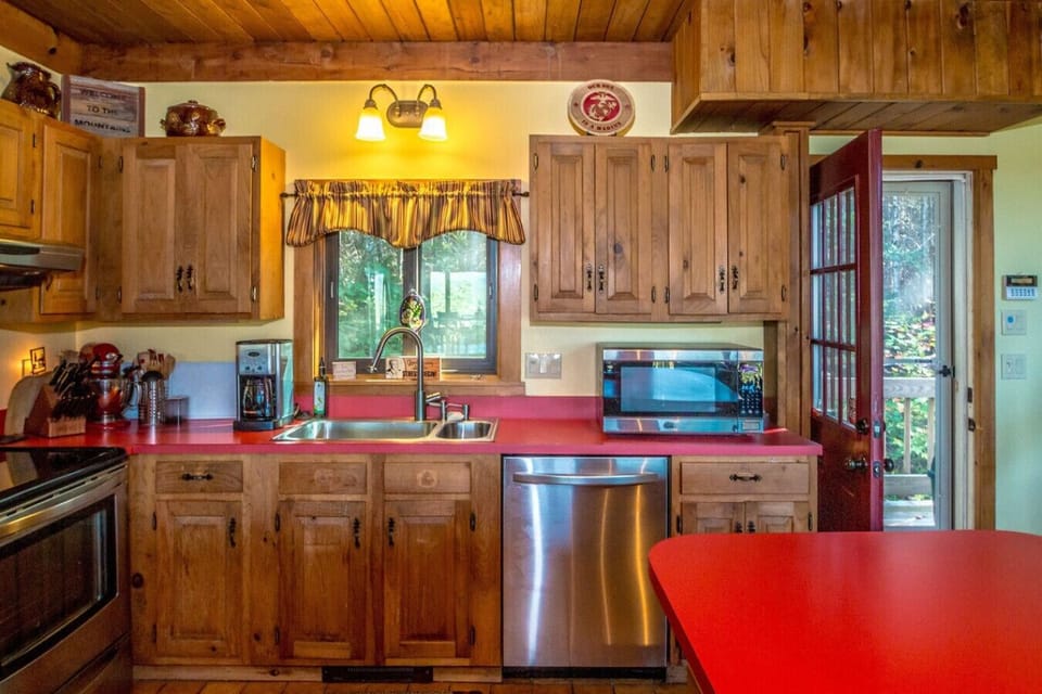 Fully equipped kitchen with everything you need for a great family meal, plus coffee and tea to start your day. Enjoy cooking indoors or fire up the grill on the back deck while taking in the views.