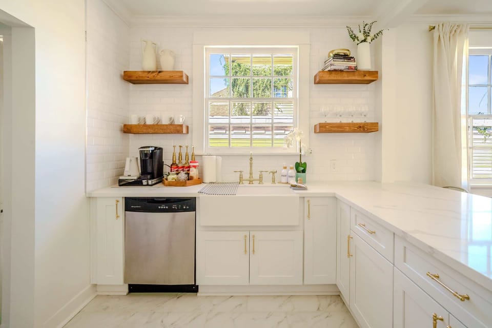 There are TWO kitchens in the home- each feature updated appliances and kitchen essentials.