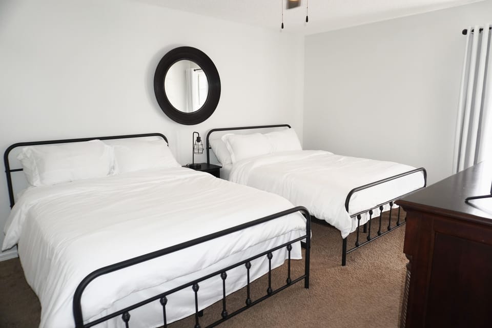 Bedroom 2- Two Queen Beds, 65” Smart TV, USB lamps