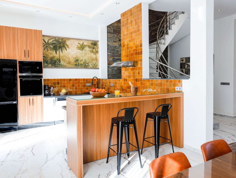 Fully equipped gourmet kitchen with premium Franke appliances and a Nespresso machine.