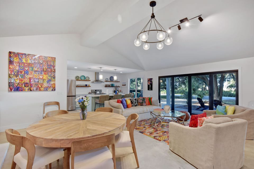 Dining Area with Marsh-Facing Light - Table seating sits beside the sliders between the kitchen and main living room.