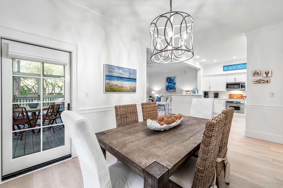 Dining for 6 under chandelier lighting