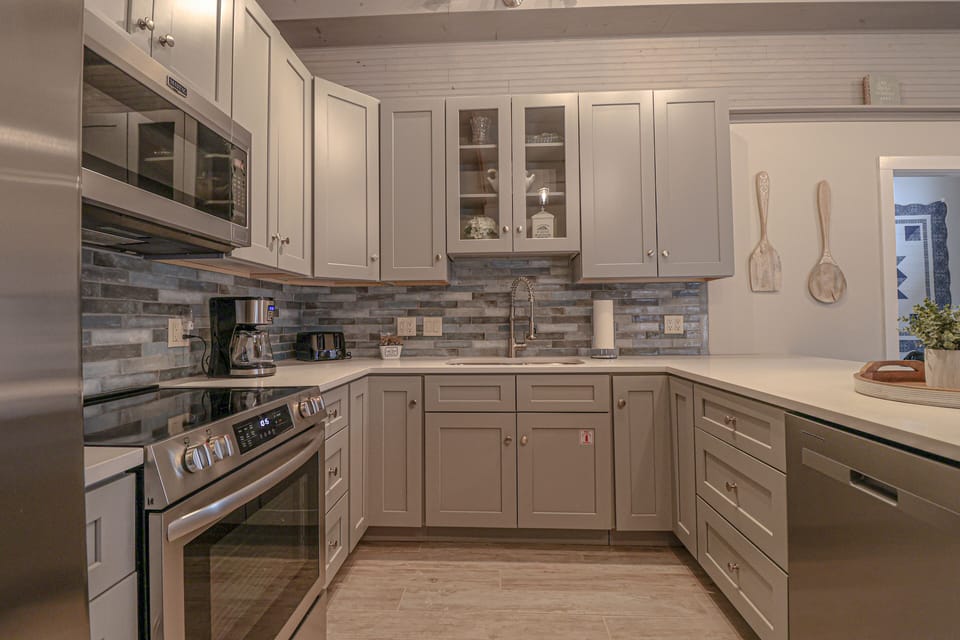 Kitchen is designed with high-end cabinets and countertops 