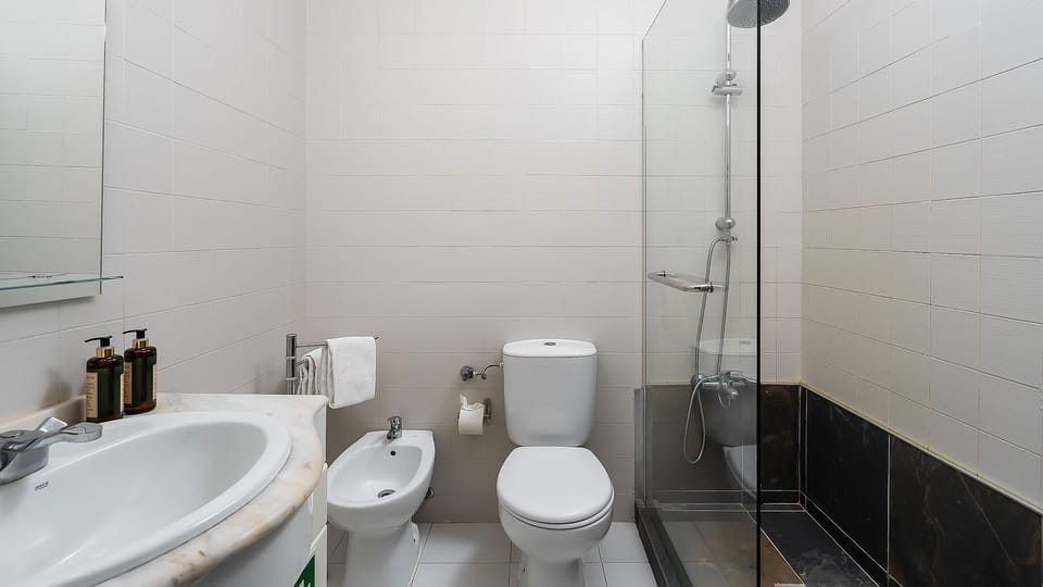 A pristine bathroom featuring a walk-in shower with a glass screen and all the essentials for your comfort.
#Bathroom #WalkInShower #LovelyStay