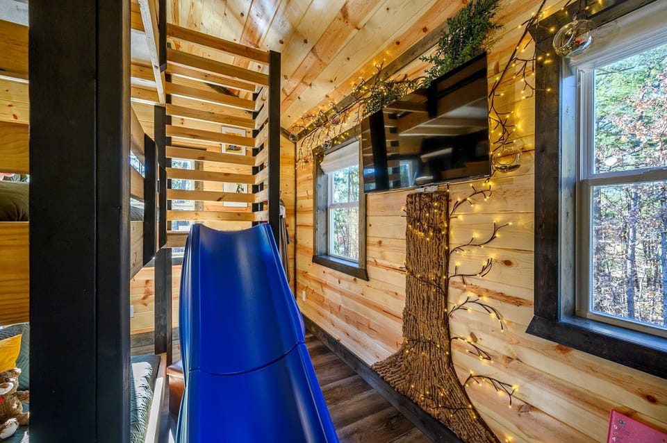 A peek into the upstairs bunk room filled with fairy tale charm, fun colors, and cozy vibes. 