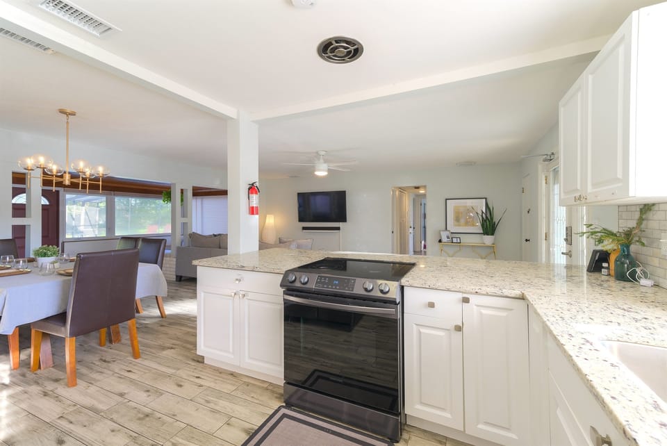 The open floor plan allows everyone to enjoy cooking and hanging out together.