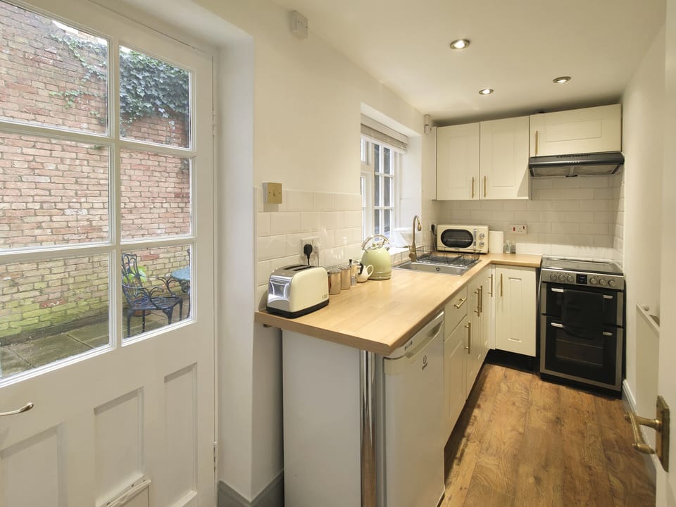 Galley kitchen with beautiful view of the garden