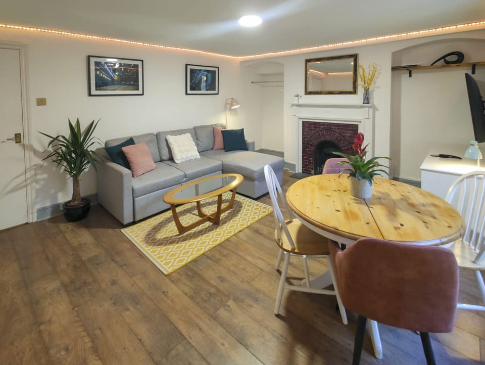 Living room with dining table & seating x4, 50" TV, double sofa bed, LED Lights