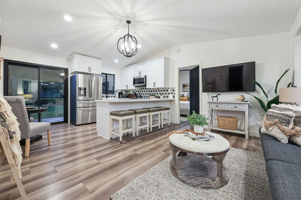 Open floor plan with kitchen, living room, and dining area for 2.