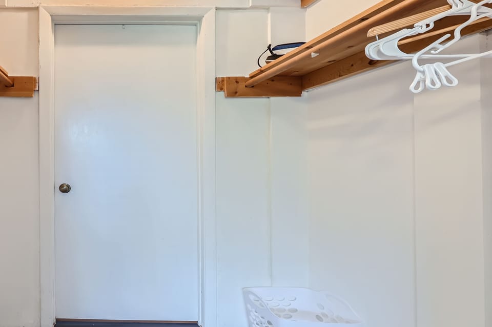 Bedroom storage, a connected closet with plenty of space for bags and clothes.