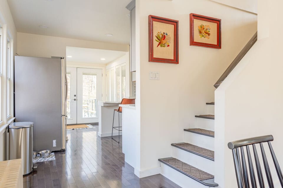 View of back deck entrance and stairs leading to bedrooms