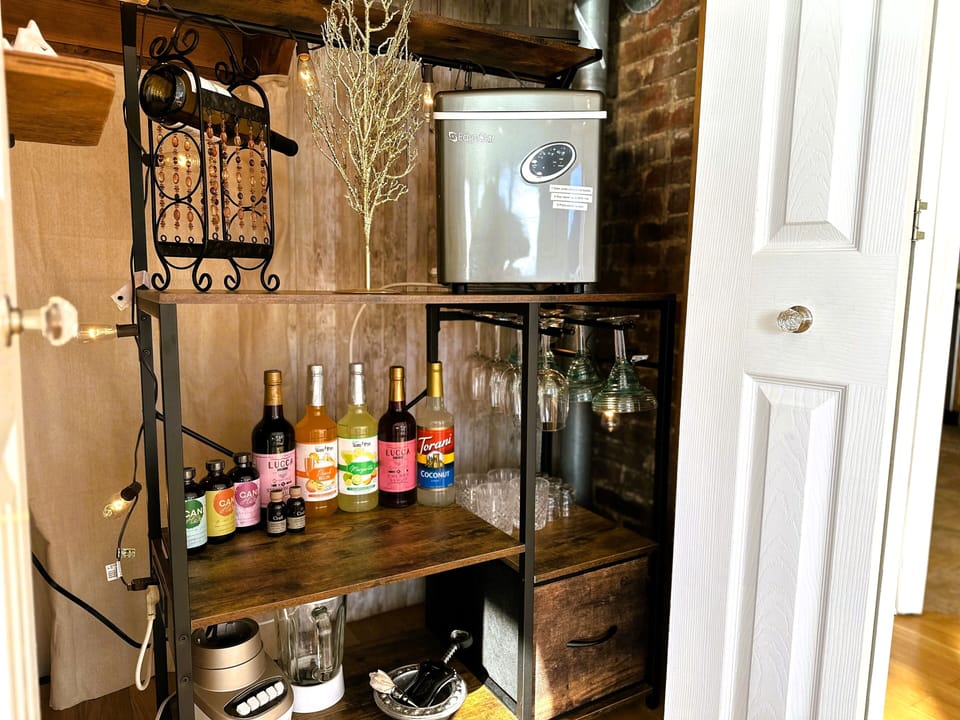 The "secret bar" with ice maker, blender, wine glasses and more