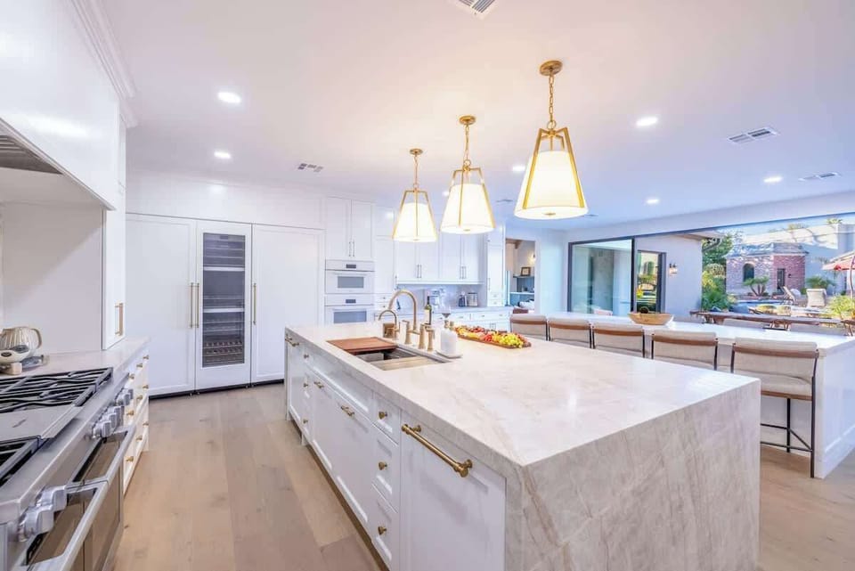 Chef’s Kitchen with Double Islands – A dream culinary space with custom cabinetry, premium appliances, and dual islands with seating for entertaining in style.