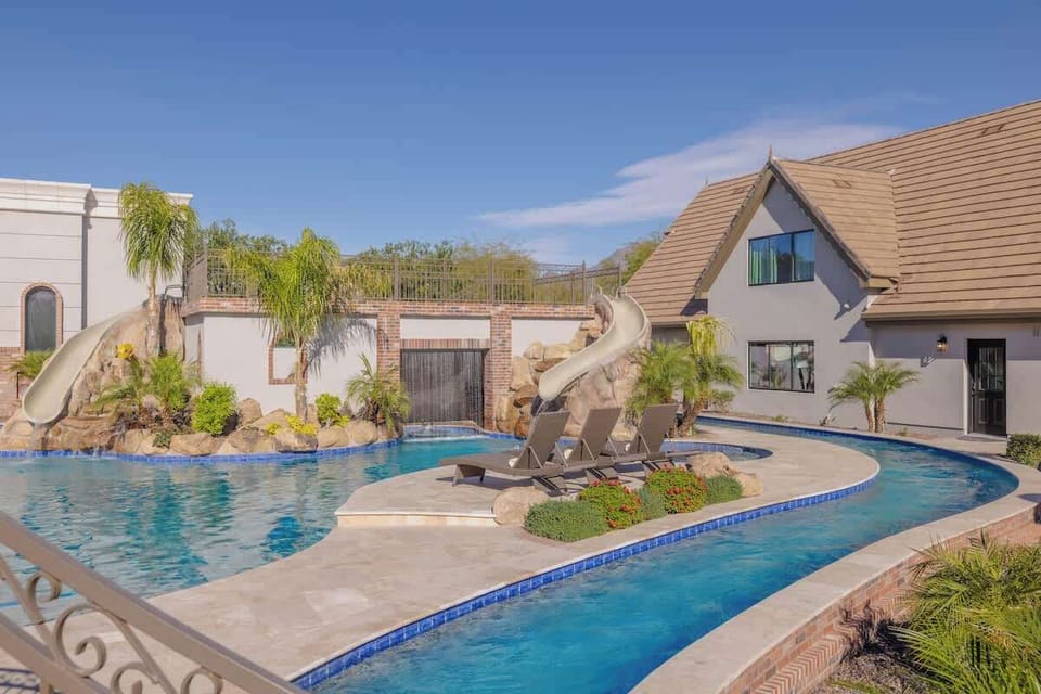 Sun-Soaked Relaxation – Multiple lounging areas by the pool, perfect for soaking up Arizona sunshine.