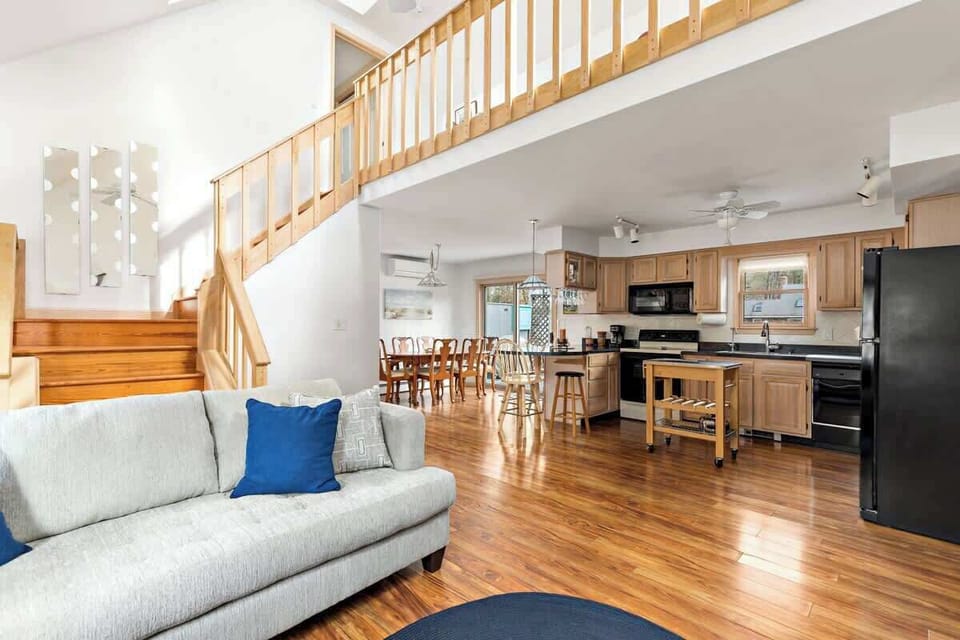 Gorgeous vaulted ceilings in the living room. The open concept space connects to the kitchen and dining area