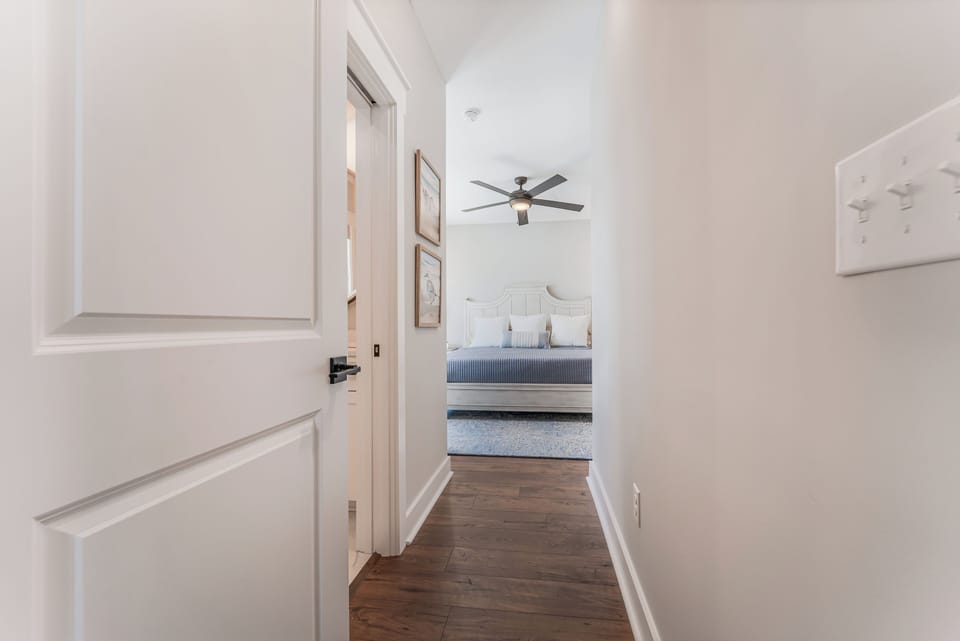 Private hallway to the top-floor king bedroom with private bath.