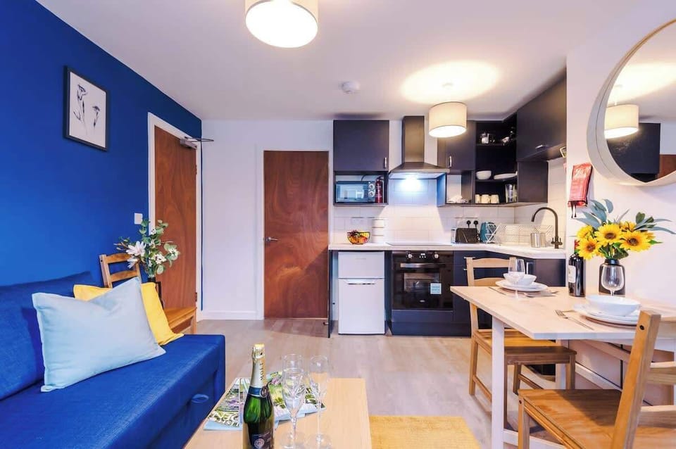 The open plan living room benefits from a double sofa bed, 4 seater dining table and fully equipped kitchen.