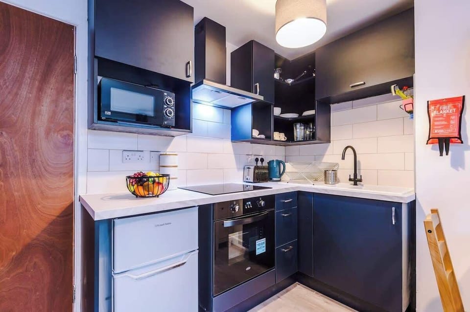 The open plan living room benefits from a double sofa bed, 4 seater dining table and fully equipped kitchen.