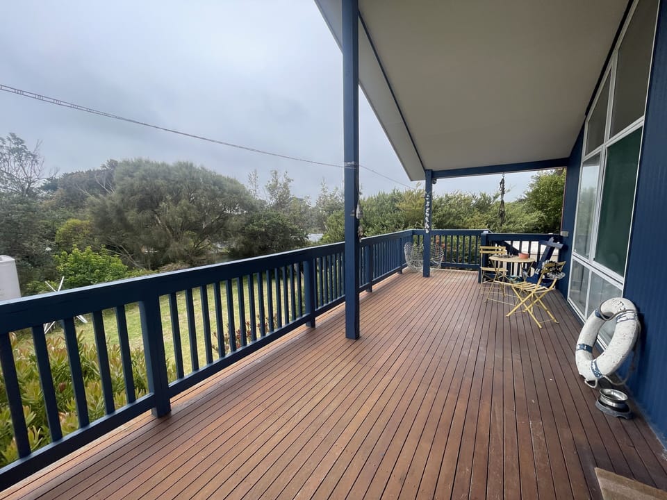 Spacious deck surrounded by greenery