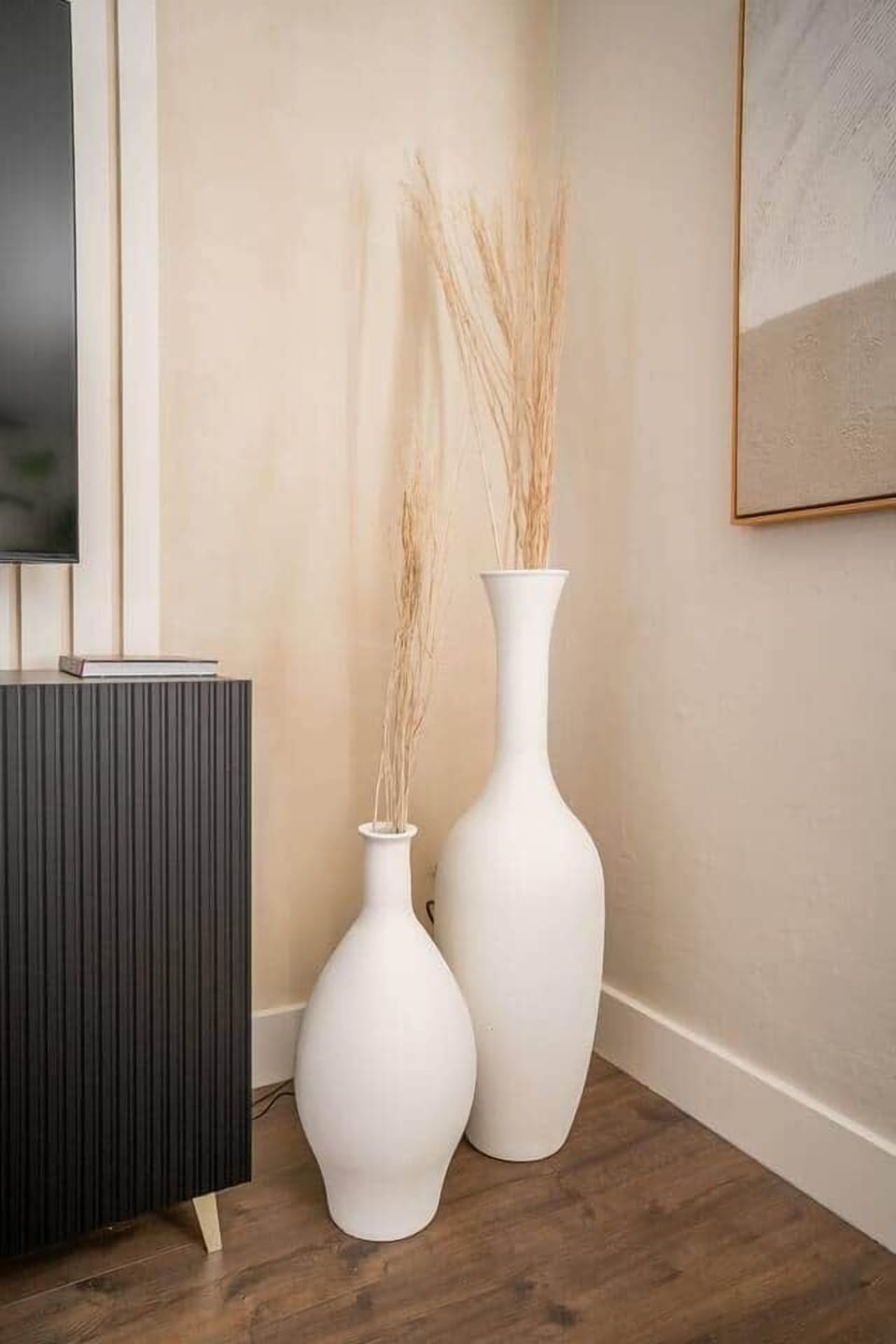 Decorative vases by media console.