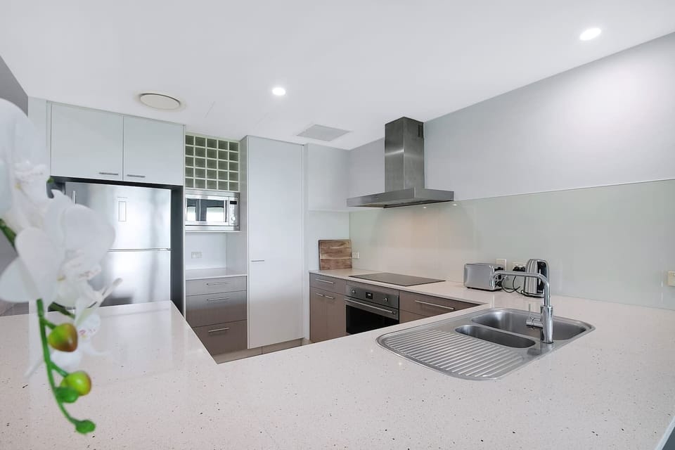 The modern kitchen is immaculately appointed with all you need to prepare meals, plus a dishwasher for easy clean-up.  
