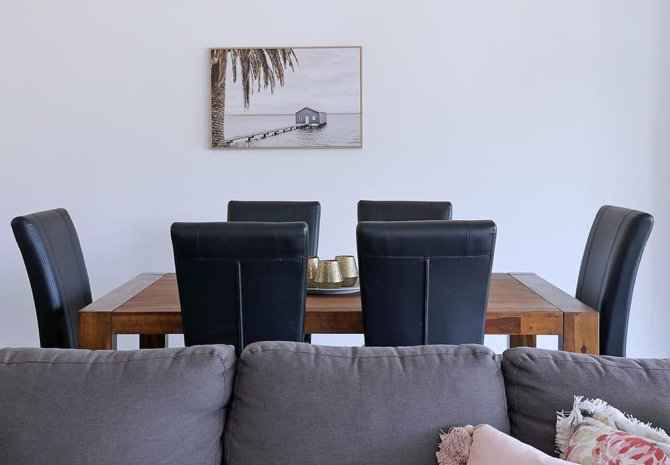 The dining area features a six-seater table where you can share meals. 
