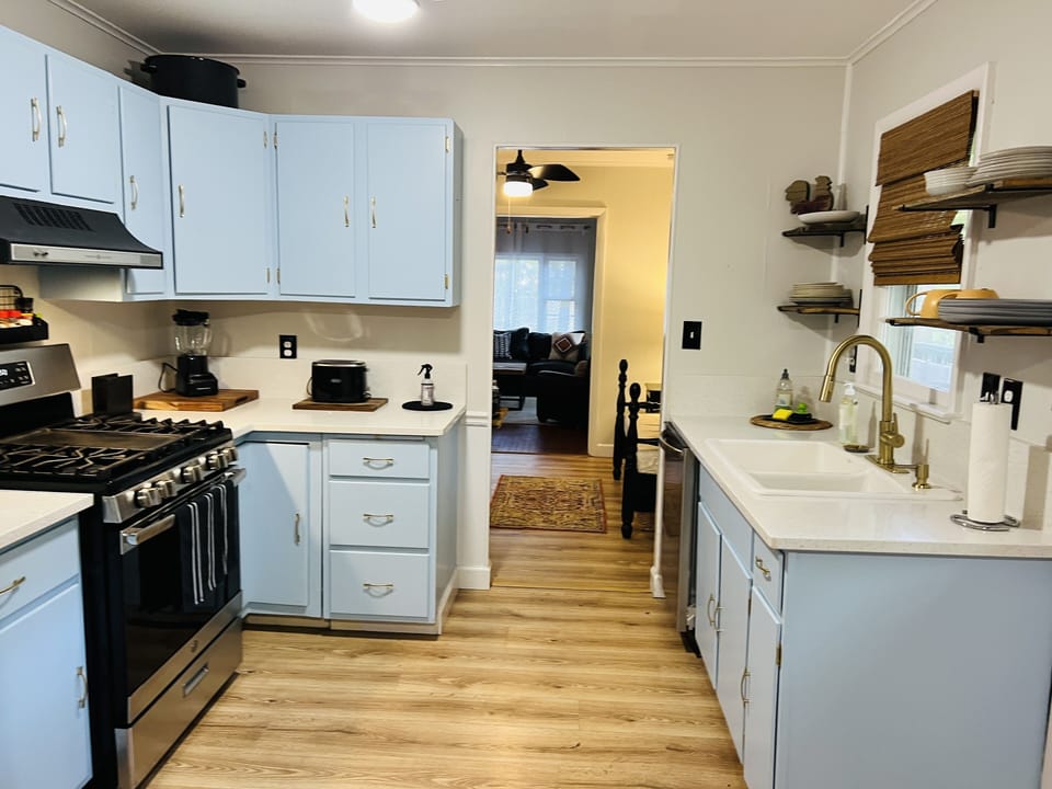 Beautiful quartz counter spaces and the joy of cooking on a gas fire stove.