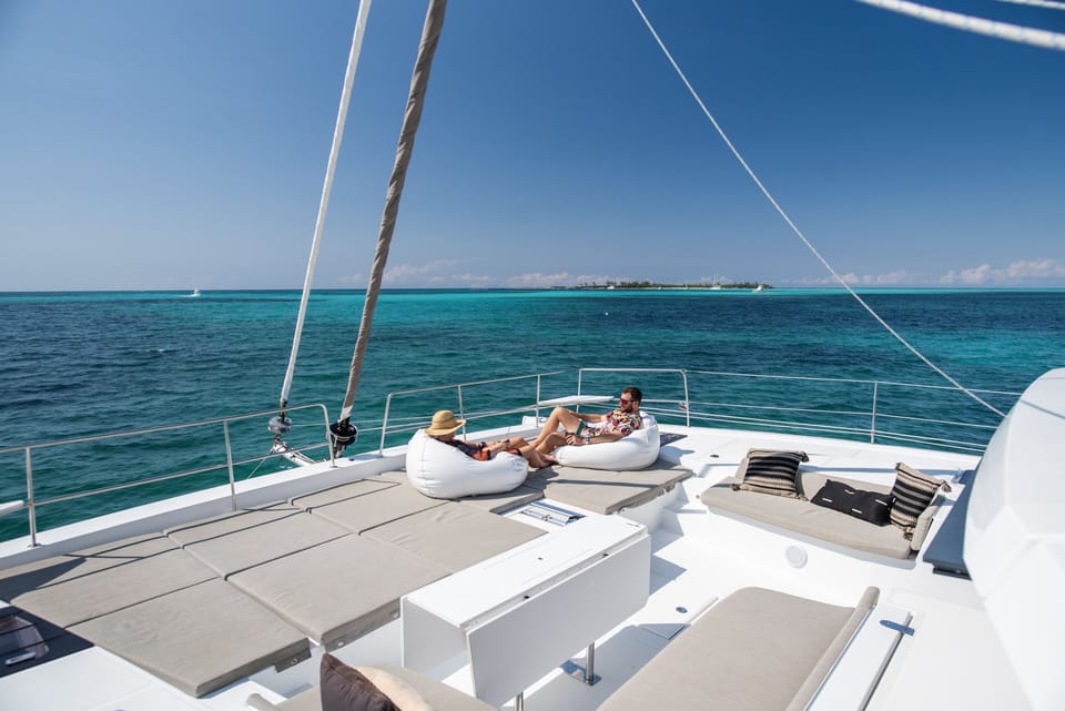 Enjoying the sun and a cocktail on Location's Foredeck.