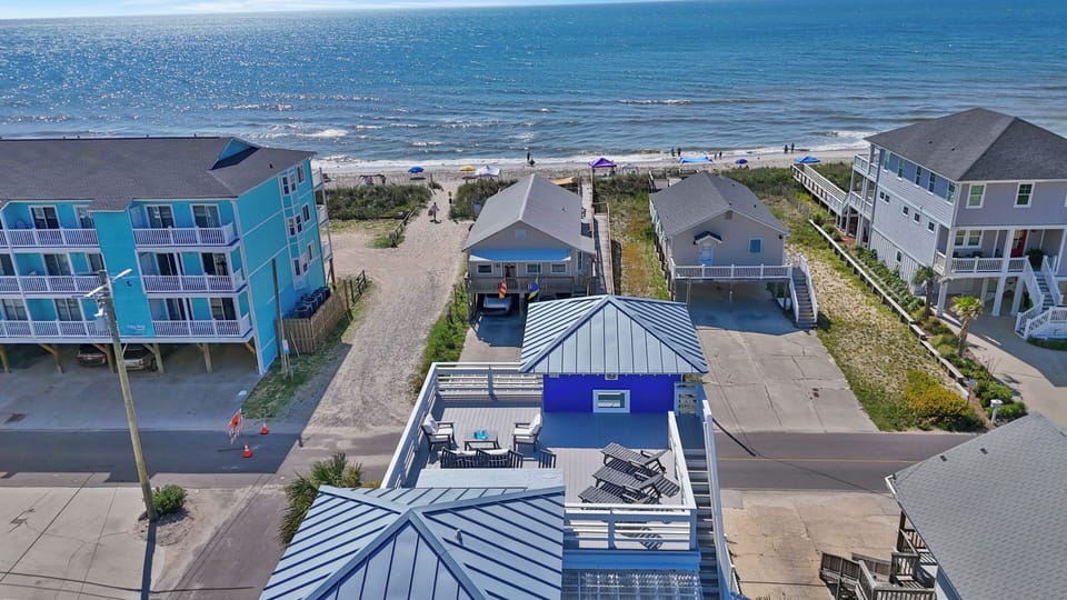 Enjoy unbeatable convenience with public beach access just across the street