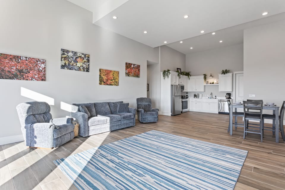 Massive family room with recliner couches and love seats, 20' ceilings