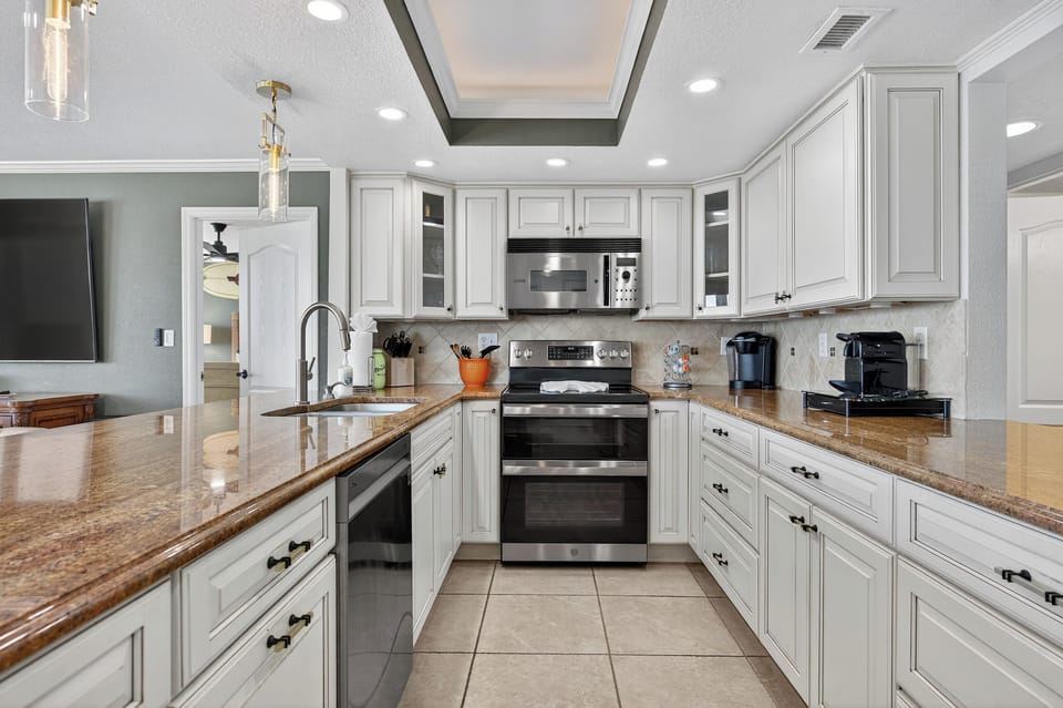 Unique galley kitchen with pass through on the side opposite the living room