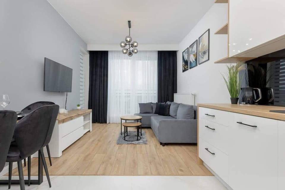 Living room with a dining area and a kitchenette