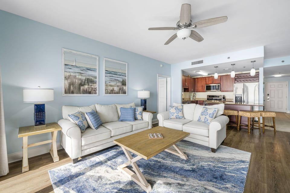 Relax in this coastal-inspired living room with comfortable seating and ocean-themed decor.