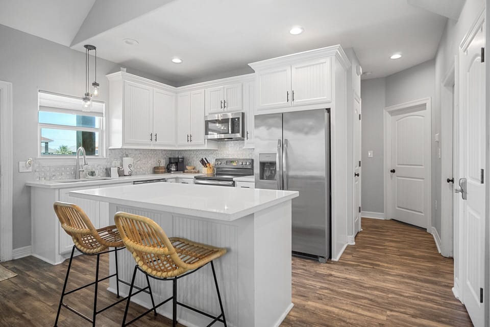Bask in the charm of this airy and inviting kitchen, where natural textures and light hues create a tranquil escape for culinary creativity.