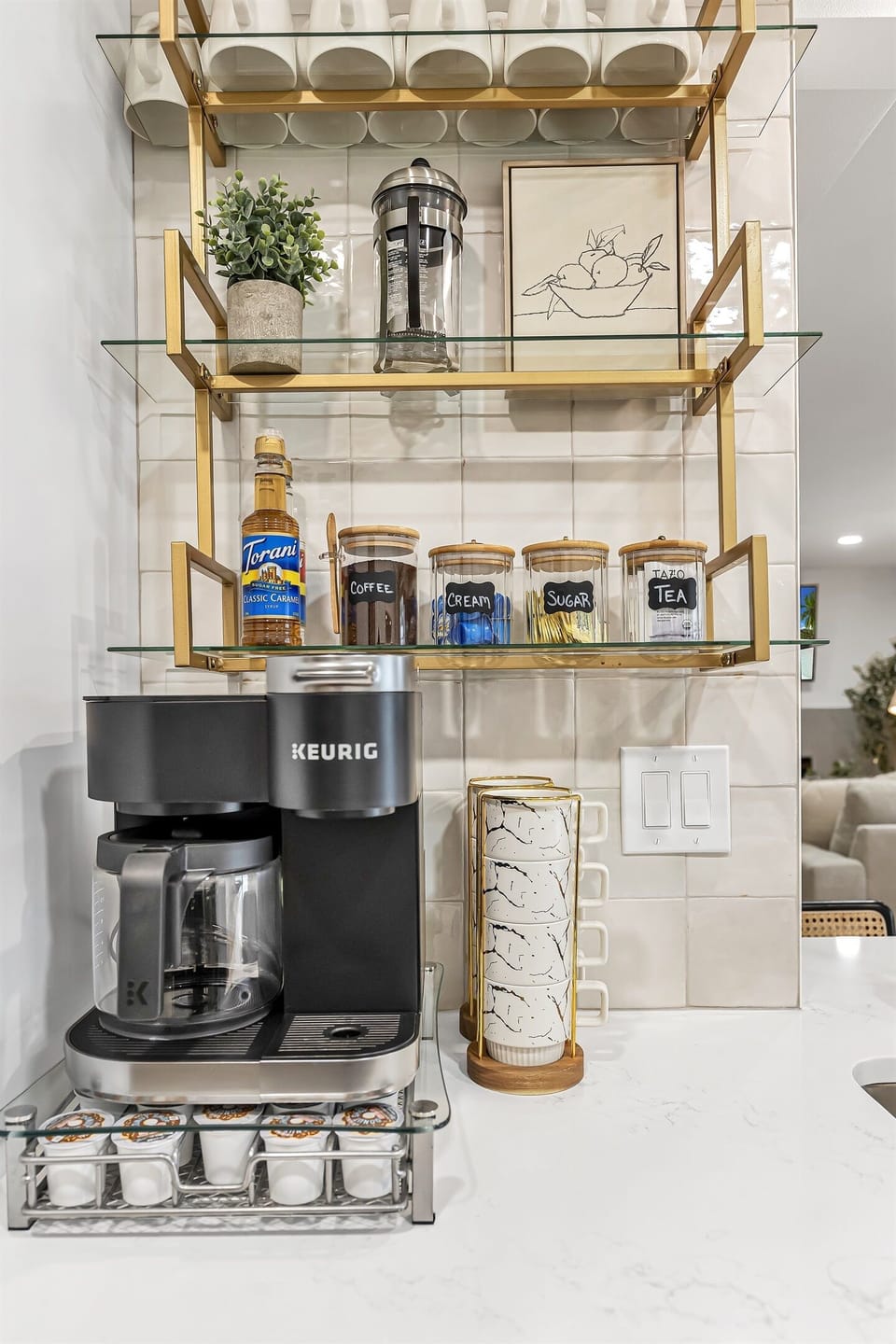 Start your day with a touch of elegance at this modern, fully equipped coffee bar.