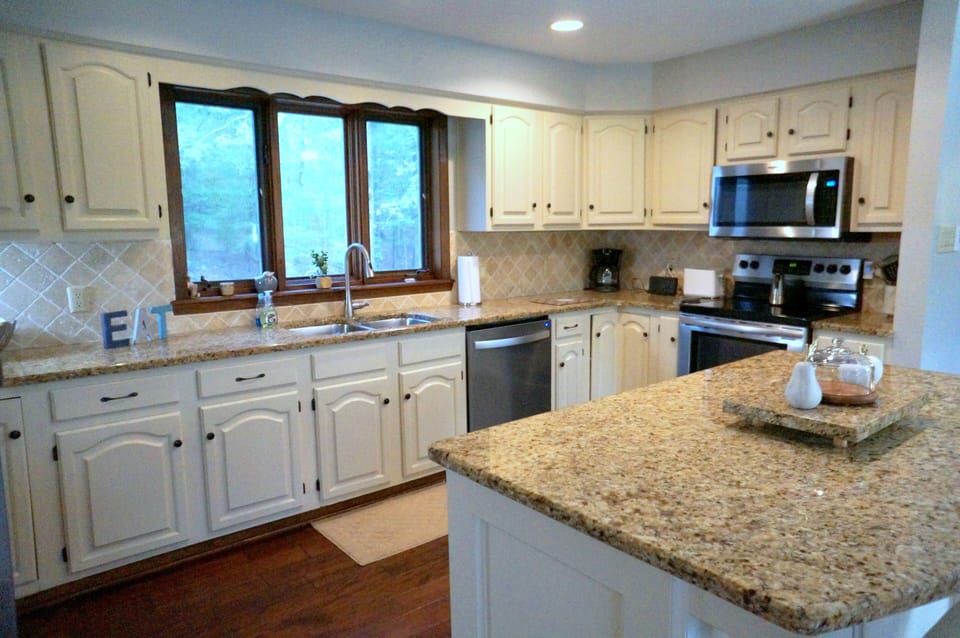 STAINLESS MICROWAVE, DISHWASHER & STOVETOP/OVEN.