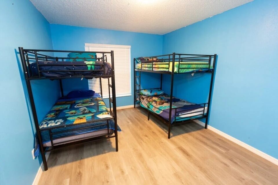 Roomy bunk bed setup with colorful touches for kids or group stays.