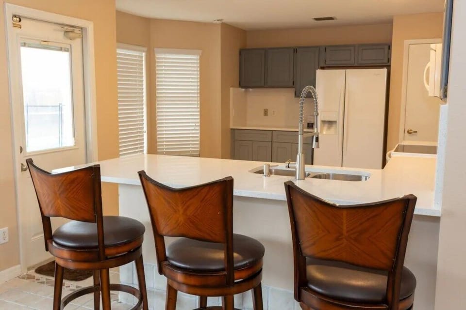 Cozy breakfast bar with seating for casual dining or quick snacks.