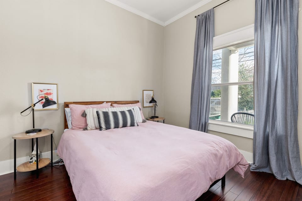 Bedroom sanctuary: where the bed beckons for dreams, and the window offers a canvas of calming views