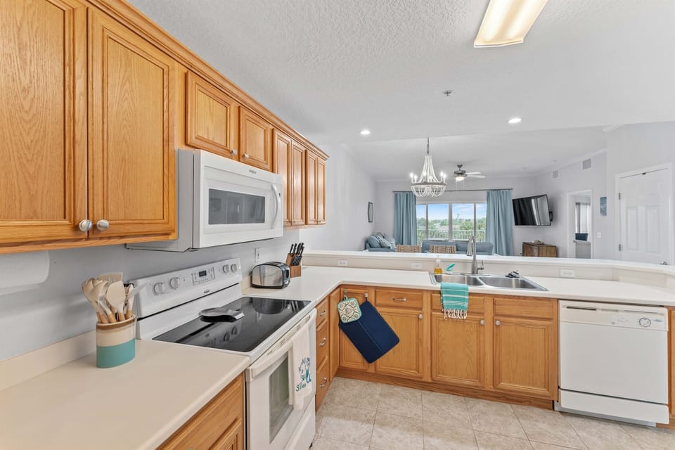 Full sized kitchen stocked with cooking essentials