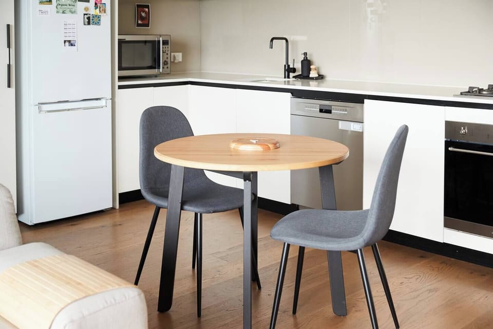 An open-plan layout includes a cosy table where you can share meals.
