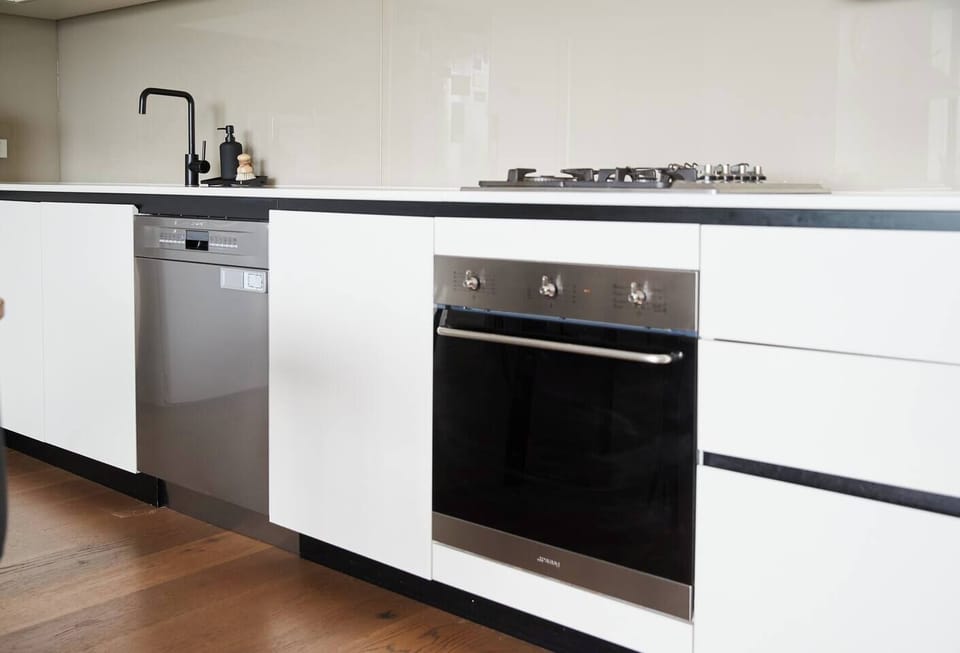 When you're not sampling the local dining scene, a modern, streamlined kitchen has all you need to cook at home plus a dishwasher for easy clean-up.  
